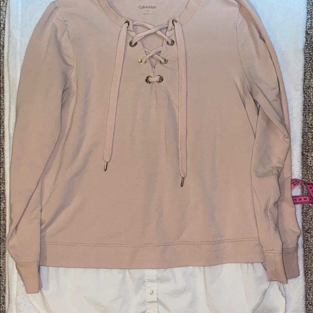 Light pink Calvin Klein sweater with dress shirt